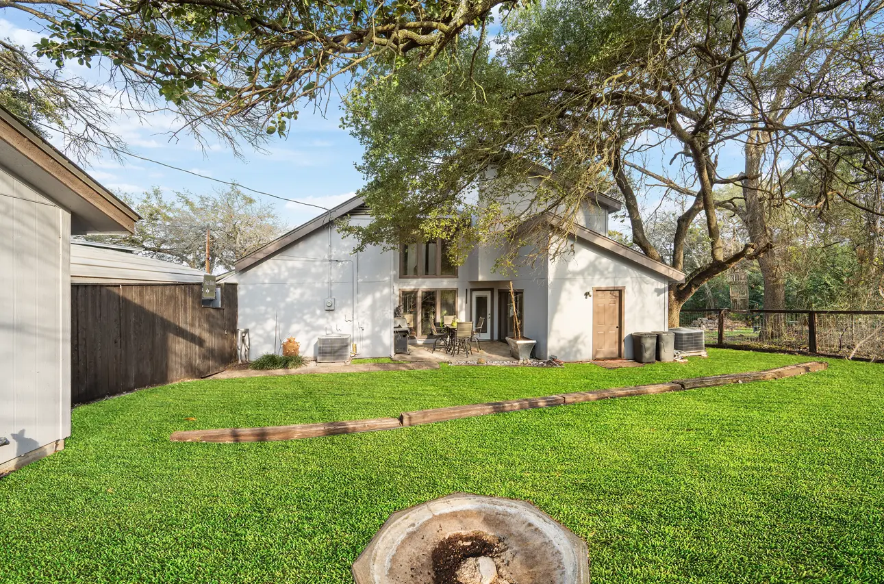 Same backyard with lush green lawn after digital lawn replacement