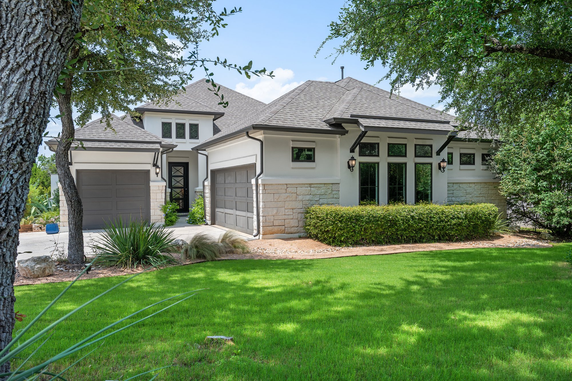 Original daytime exterior photo of a Texas hill country home